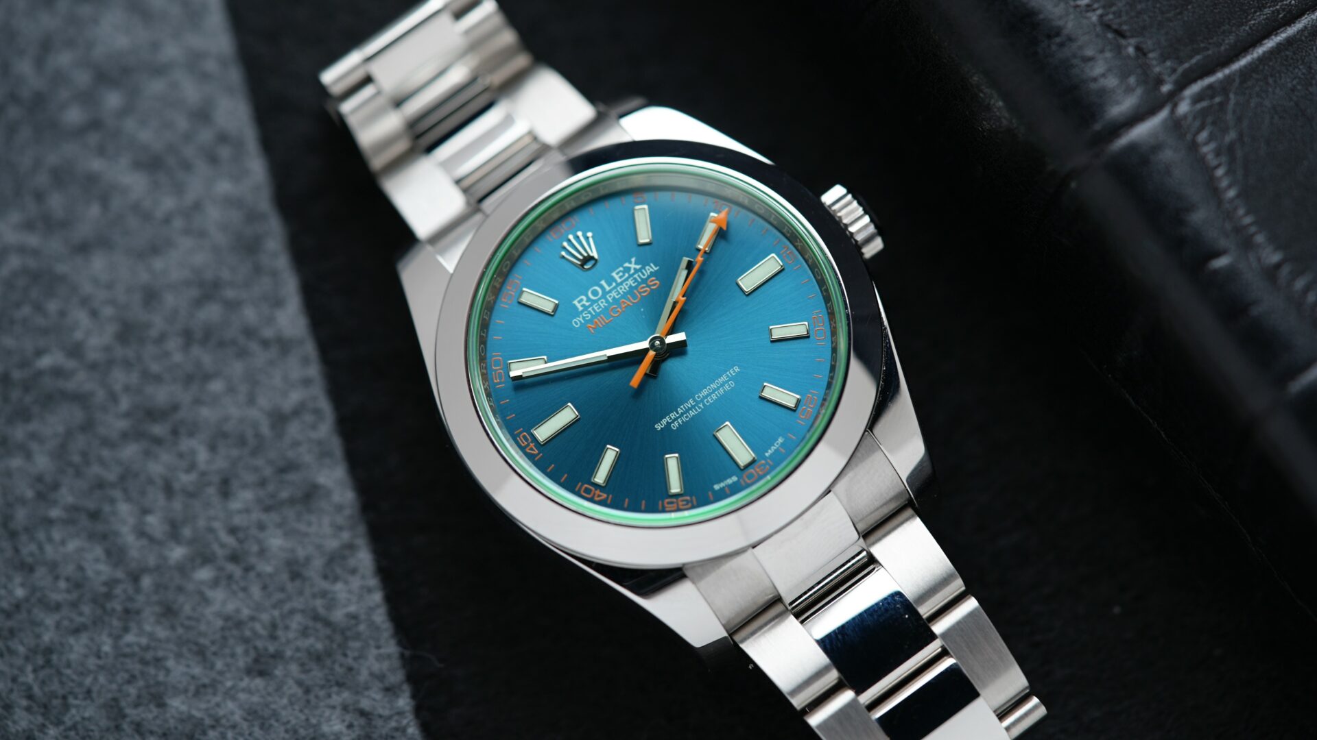 Rolex Milgauss Z Blue UNWORN 116400GV wristwatch on display on an angle under white light.