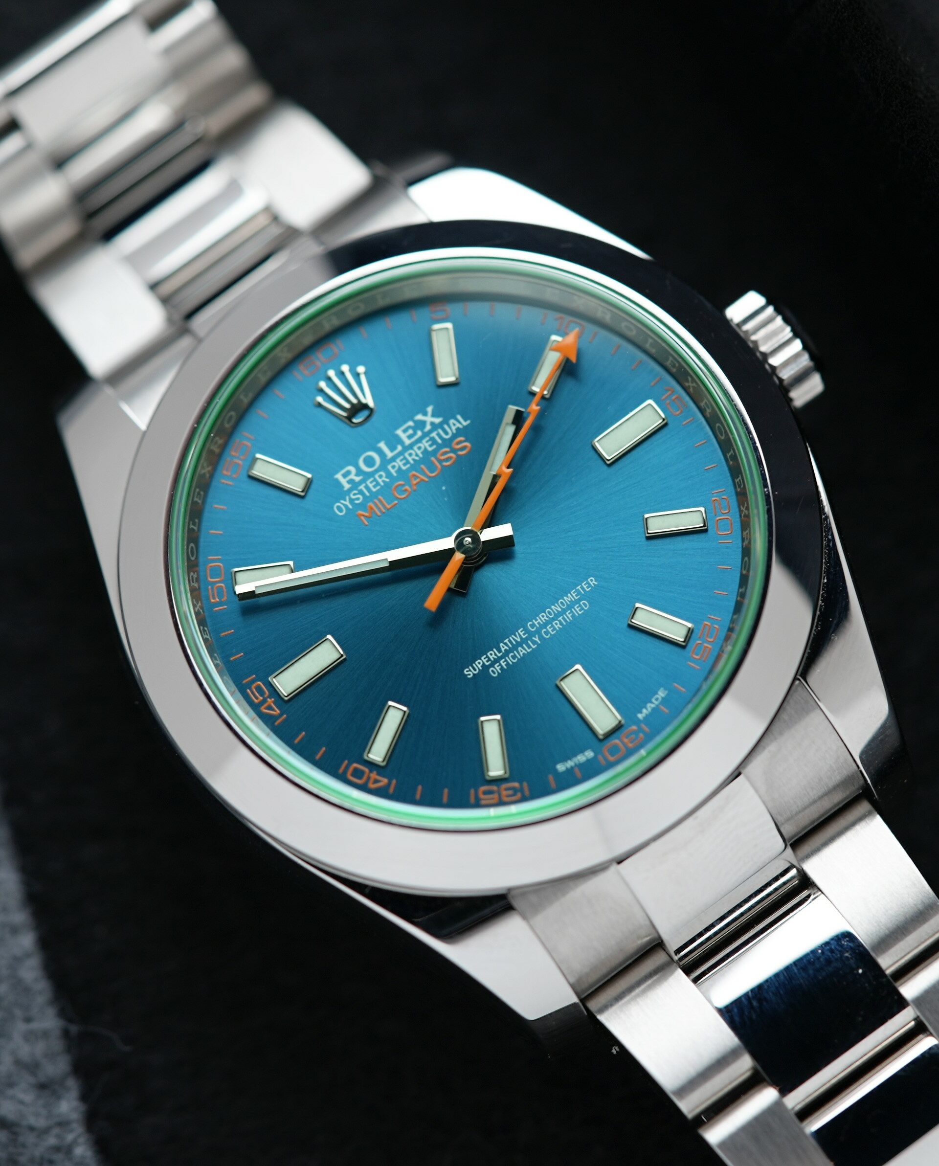 Rolex Milgauss Z Blue UNWORN 116400GV wristwatch on display on an angle under white light.