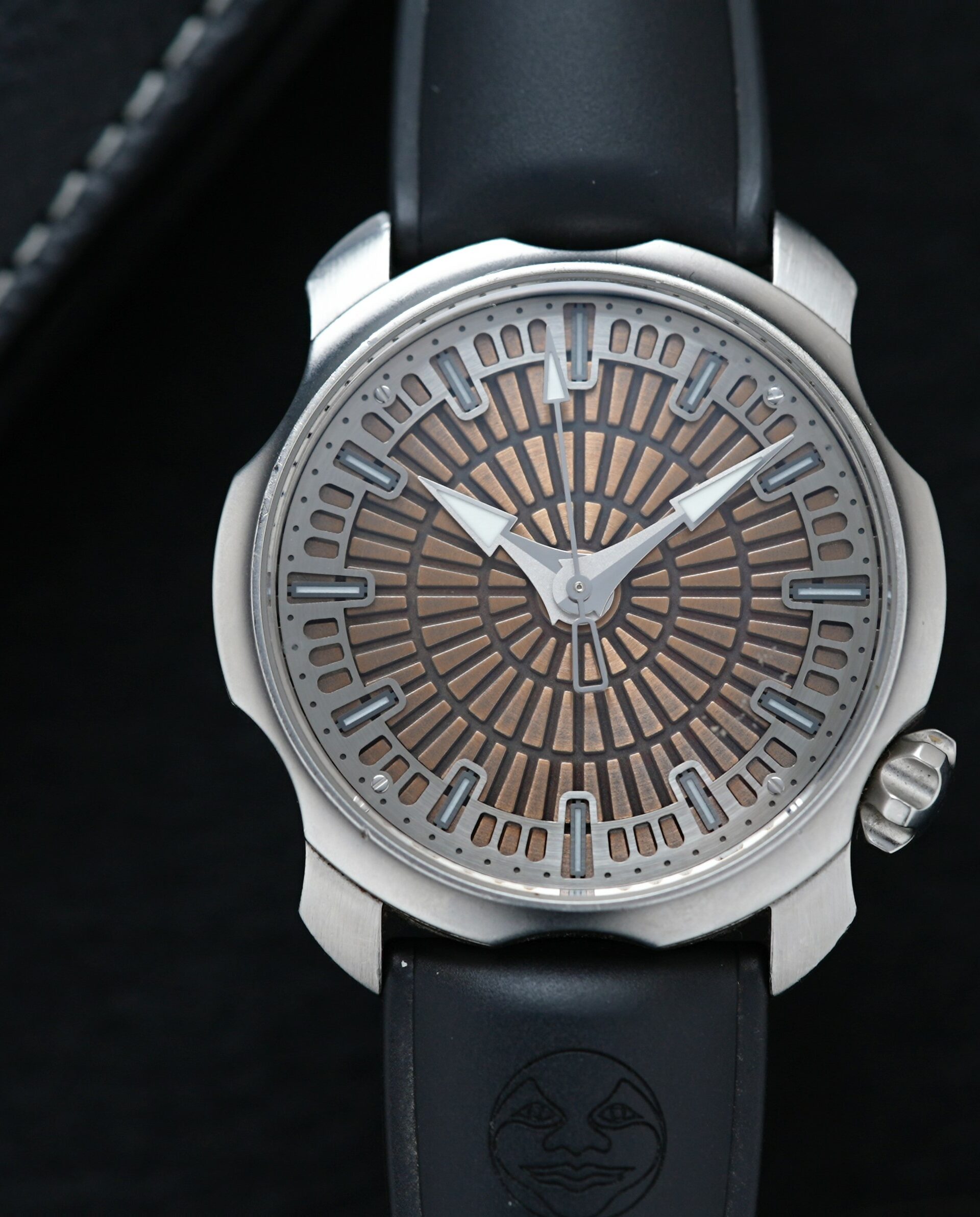 Sarpaneva Super1 watch featured under white light with binder in background.