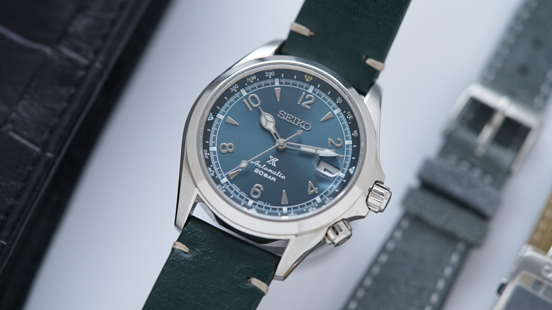 Seiko Alpinist Limited Edition Alpinist Mountain Glacier SPB199J1 watch on display featuring the full set.