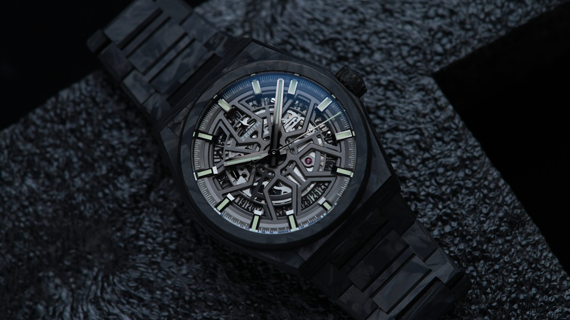 Zenith Defy Classic Carbon Fiber watch featured under white lighting on an angle.