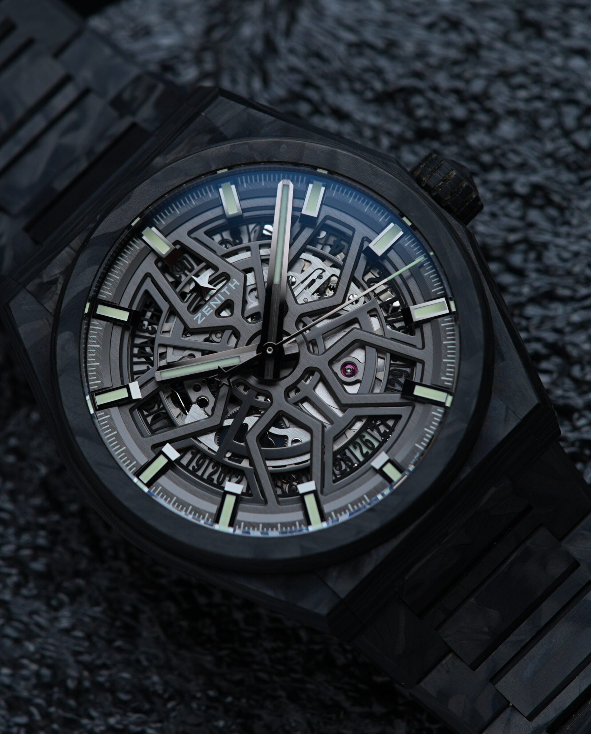 Zenith Defy Classic Carbon Fiber watch featured under white lighting on an angle.